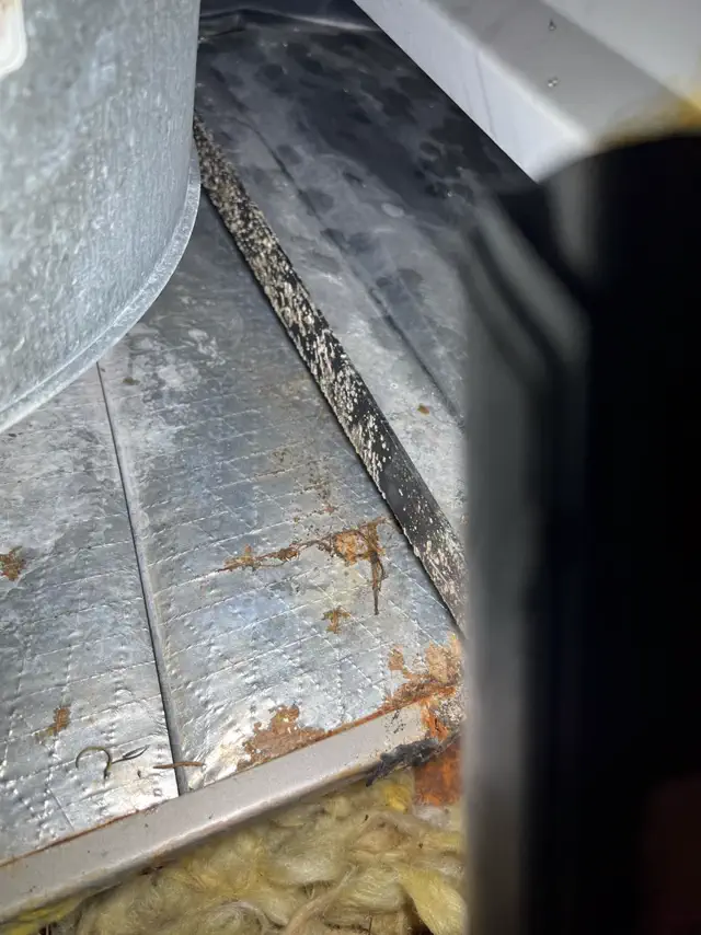 Flex duct run in a crawlspace being repaired
